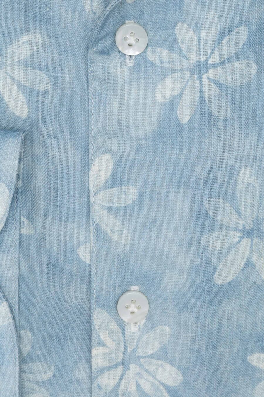 Light blue linen with white tropical flowers